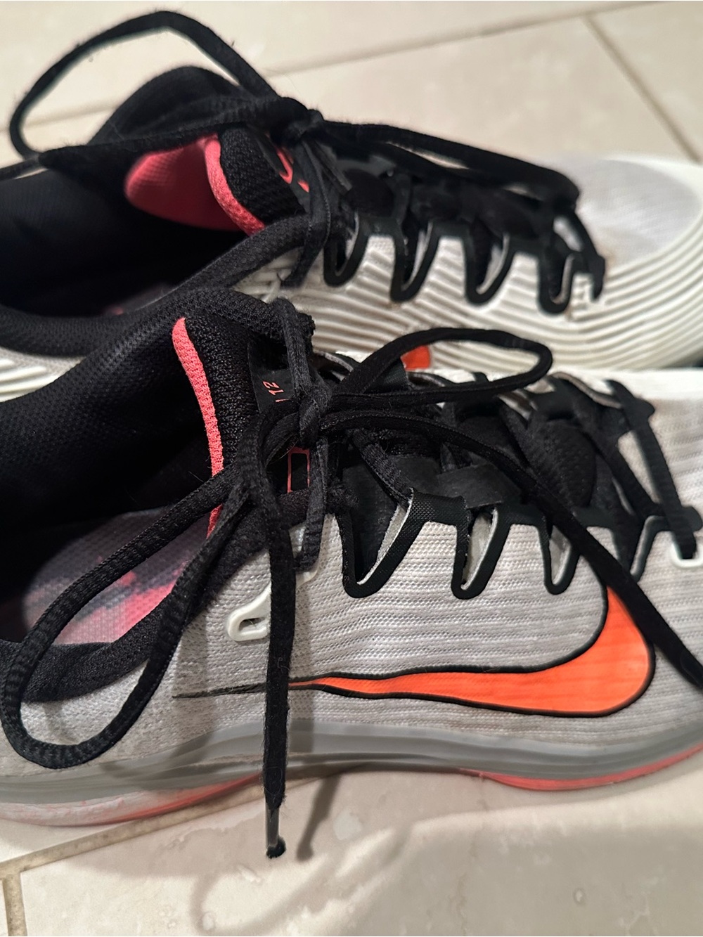Nike Men's White and Black Running Shoes with Coral-Orange Swoosh